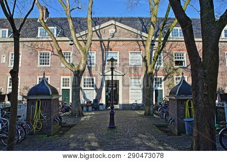 Amsterdam, Netherlands - February 23, 2019: The Internal Courtyard Of Karthuizerhof Hofje, Located I