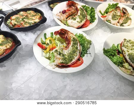 Cooked Lobster With Pesto, A Lot Of Shrimps, Prawns And Fresh Vegetables, Close Up.