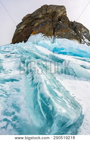 Cape Khoboy Rock On Olkhon Island, Lake Baikal, Ice Hummocks In Winter, Russia, Siberia