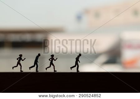 Miniature People Is Running , Silhouette Of A Runner , Health And Lifestyle Concepts.