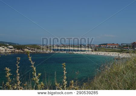 Wonderful Beach Of Area Gorda In La Lanzada In Noalla. Nature, Architecture, History, Travel. August