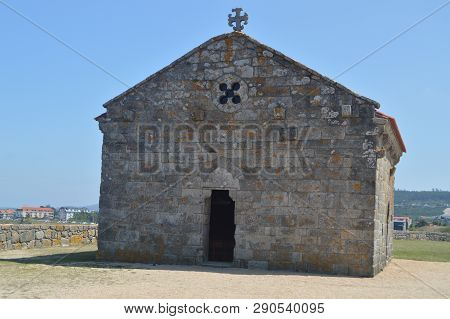 Main Facade Of The Hermitage Of Our Lady Of The Lanzada In Noalla. Nature, Architecture, History, Tr