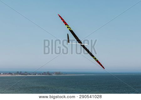 Rc Remotely Controlled Soaring Plane Model Sailplane On Blue Sky In Brisk Wind