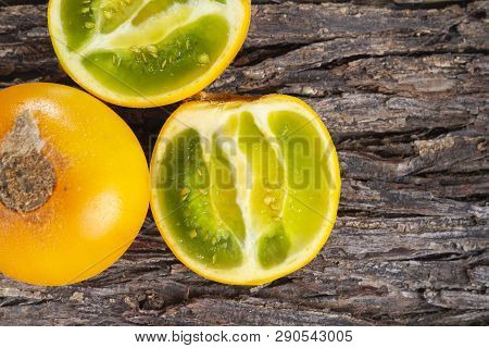 Fruit Of Lulo On Tree Bark (solanum Quitoense)