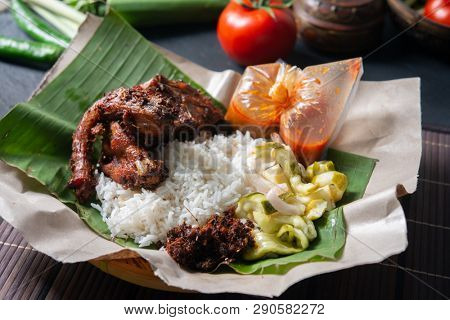 Nasi lemak kukus with quail, popular traditional Malay local food.