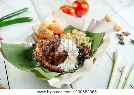 Nasi lemak kukus with quail, popular traditional Malay local food.