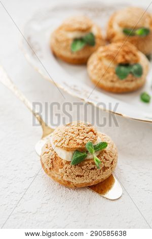 Homemade Profiteroles On The Music Sheet With Notes. Profiteroles (choux à La Crème) - French Choux