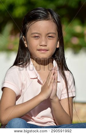 A Filipina Female Praying