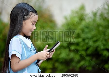 Beautiful Female Student Wearing School Uniform With Tablet