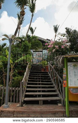 MARIGOT, SINT MAARTEN - JULY 31, 2015: Entrance to Le - Mini club restaurant view from street side In French part island.