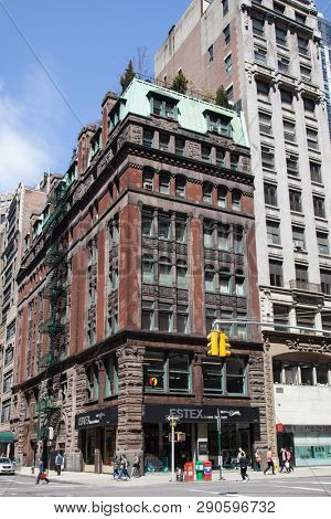 NEW YORK, NY, USA - APRI 22, 2015: Street view with old building with ESTEX home fashions sign on W30th st and 5th Ave