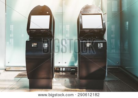 Two Black Electronic Check-in Counters In The Departure Area Of The Airport Terminal Or Railway Stat
