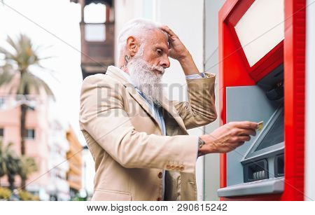 Happy Mature Man Withdraw Money From Bank Cash Machine With Debit Card - Senior Male Doing Payment W