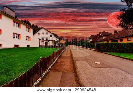 A Village Street With Futuristic Interplanetary Sky.