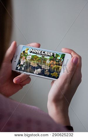 Los Angeles, California, Usa - 8 March 2019: Hands Holding A Smartphone With Minecraft Pocket Editio