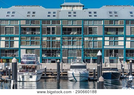 Historic Woolloomooloo Wharf With Luxury Boats And Yachts In Front Of The Building. Tourist Landmark