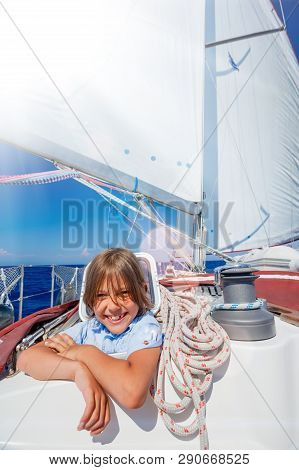 Little Boy On Board Of Sailing Yacht On Summer Cruise. Travel Adventure, Yachting With Child On Fami