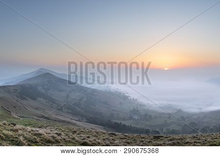 Beautiful Winter Sunrise Landscape Image Of The Great Ridge In The Peak District In England With A C