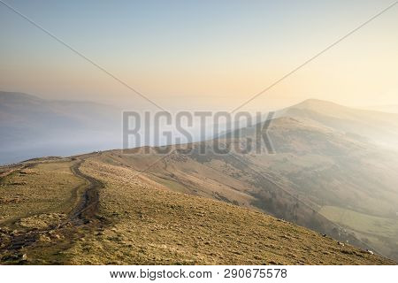 Beautiful Winter Sunrise Landscape Image Of The Great Ridge In The Peak District In England With Mis