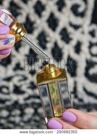Arabian Oud Attar Perfume Or Agarwood Oil Fragrances In Glass Bottles.