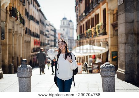 Young Happy Woman Exploring Center  Of Madrid. Visiting Famous Landmarks And Places.cheerful Female