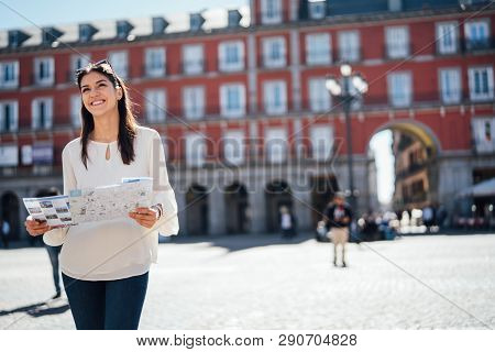 Young Happy Woman Exploring Center  Of Madrid, Visiting Famous Landmarks And Places.cheerful Female