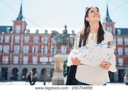 Young Happy Woman Exploring Center  Of Madrid. Visiting Famous Landmarks And Places.cheerful Female