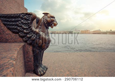 Sphinxes And Griphon In St. Petersburg. Panorama Of Petersburg Under A Blue Sky With Clouds