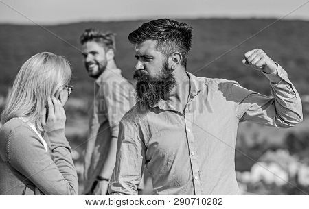 Husband Strictly Watching His Wife Looking At Another Guy While Walk. Violence Concept. Man With Bea