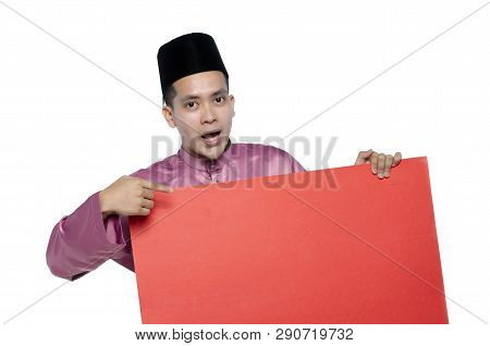 Portrait Of Young And Handsome Asian Man With Traditional Clothing Holding Red Cardboard