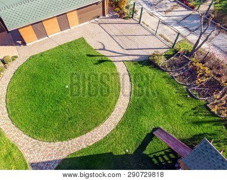 Aerial Drone View Of Backyard Garden With Circle Wath Path, Green Grass Lawn And Trees. Landscape De