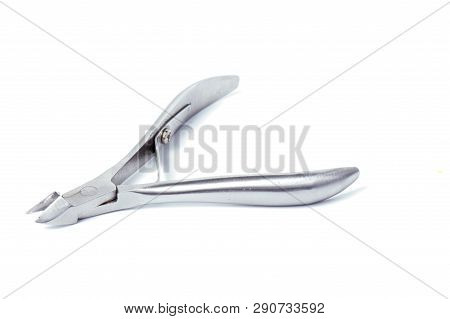 Nail Clippers To Remove The Cuticle And Nail Care Products On A Light Background.