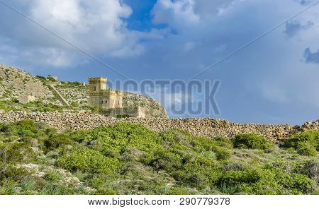 Ghar Lapsi Tower On A Hilly Landscape In Malta. Medieval Watchtower