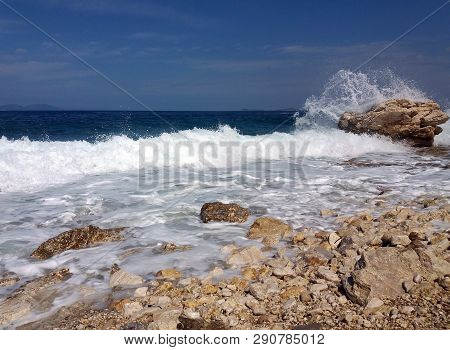 Summer Albania Beach View. Ionian And Adriatic Sea. Seashore With Wave Sand Rock Stone Sky And Sun. 