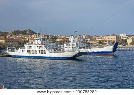 Isola Maddalena, Sardinia, Italy - March 7, 2019: Ferries Moored In Port In La Maddalena On A Sunny 