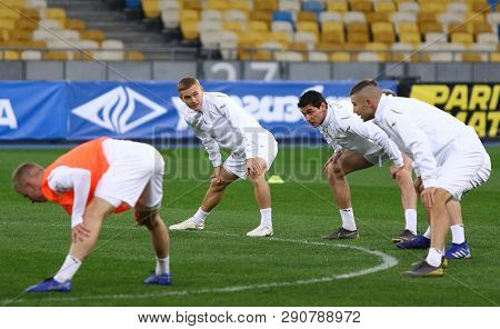 Kyiv, Ukraine - March 18, 2019: Players Stretch During The Open Training Session Of Ukraine National
