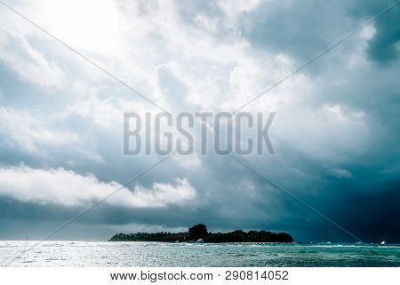 Maldives Background. Sunset Over The Tropical Sea And Coral Beach With Colorful Clouds In The Sky. B