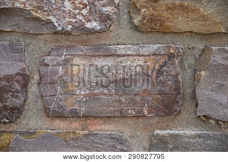 Textural Stone Wall From An Old Brick Of The Architectural Building.