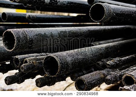 Oil Drill Pipe. Rusty Drill Pipes Were Drilled In The Well Section. Downhole Drilling Rig. Laying Th