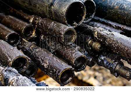 Oil Drill Pipe. Rusty Drill Pipes Were Drilled In The Well Section. Downhole Drilling Rig. Laying Th