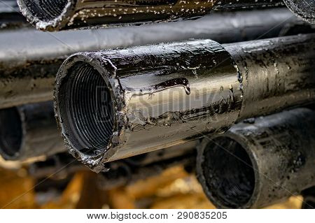 Oil Drill Pipe. Rusty Drill Pipes Were Drilled In The Well Section. Downhole Drilling Rig. Laying Th
