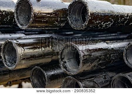 Oil Drill Pipe. Rusty Drill Pipes Were Drilled In The Well Section. Downhole Drilling Rig. Laying Th