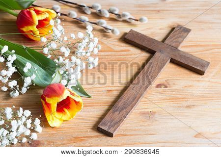 Spring Easter Flowers With Cross And Bible On Wooden Background