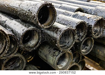 Oil Drill Pipe. Rusty Drill Pipes Were Drilled In The Well Section. Downhole Drilling Rig. Laying Th