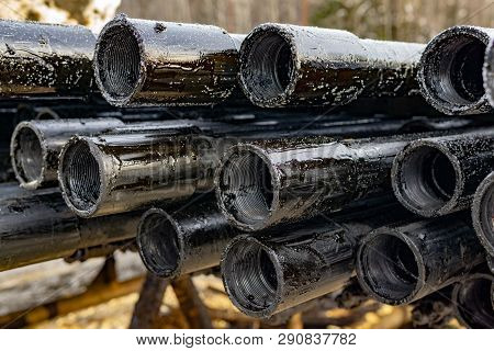 Oil Drill Pipe. Rusty Drill Pipes Were Drilled In The Well Section. Downhole Drilling Rig. Laying Th