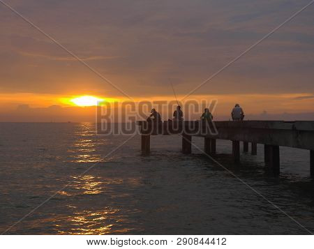 Port Dickson, Malaysia September 14, 2018 :  Jetty And Unidentified People Closeup During Sunset At 