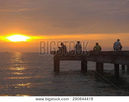 Port Dickson, Malaysia September 14, 2018 :  Jetty And Unidentified People Closeup During Sunset At 