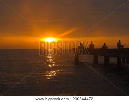 Port Dickson, Malaysia September 14, 2018 :  Jetty And Unidentified People Closeup During Sunset At 