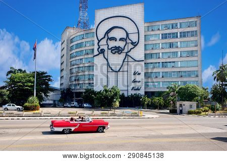 Plaza De Revolution, Havana, Cuba - 30/03/2018: Tourists On A Red Retrocar Ride Through The Building