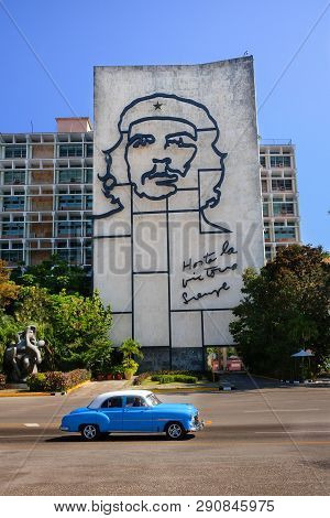 Plaza De La Revolution, Havana, Cuba - 30/03/2018: Tourists On A Blue Retrocar Ride Through The Buil